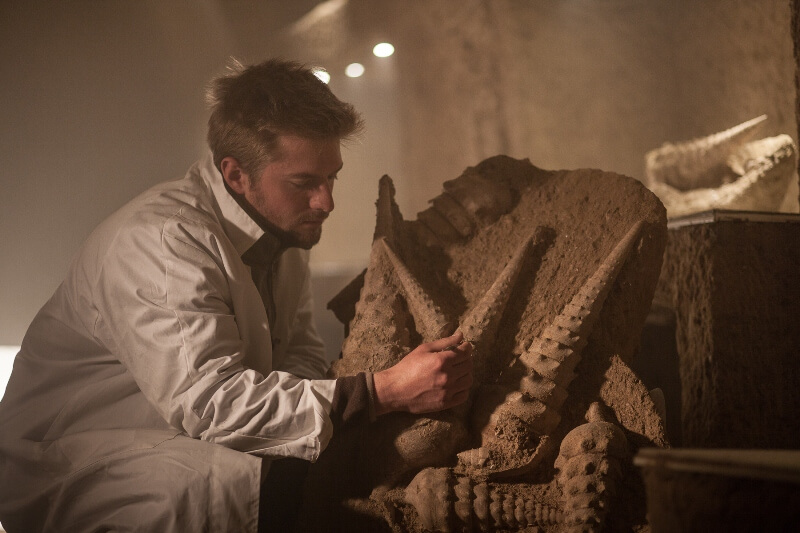 We can see a man wearing a white coat discovering shells and fossils in the Shell Cellar.